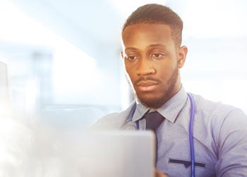 illustration of a person looking at a computer