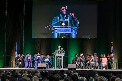 people on stage in eaglebank arena