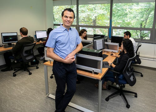 Ascoli with researchers at computer stations