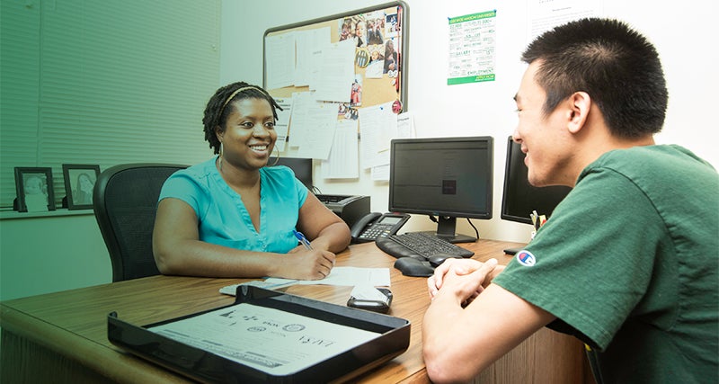 A student and Mason employee work together during a consultation