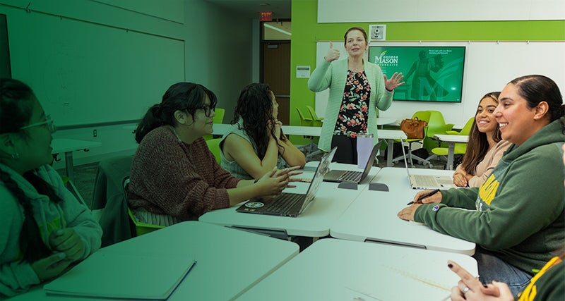 A professor speaks to a classroom of students in Horizon Hall.