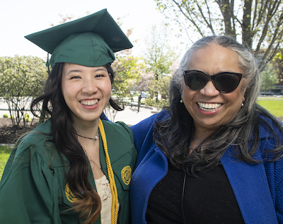 mother and daughter by the pond