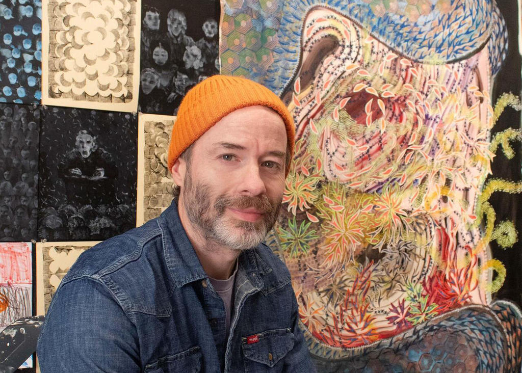 Photo of artist Jeffrey Kenney in his studio