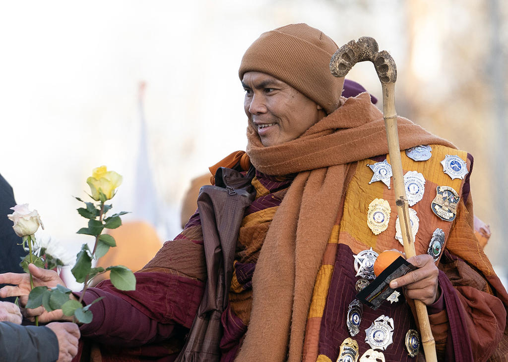 The Venerable Monks are greeted by colleagues at George Mason's Carter School during their 2300 mile walk from Fort Worth to Washington, DC.