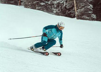 A downhill skier. Photo by Andri Klopfenstein via Unsplash